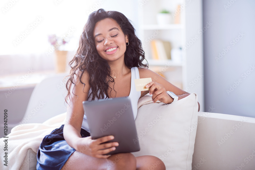 Cheerful woman using tablet Cheerful woman using tablet
