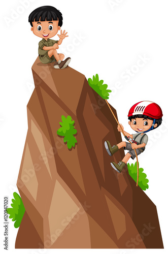Two boys climbing up the mountain