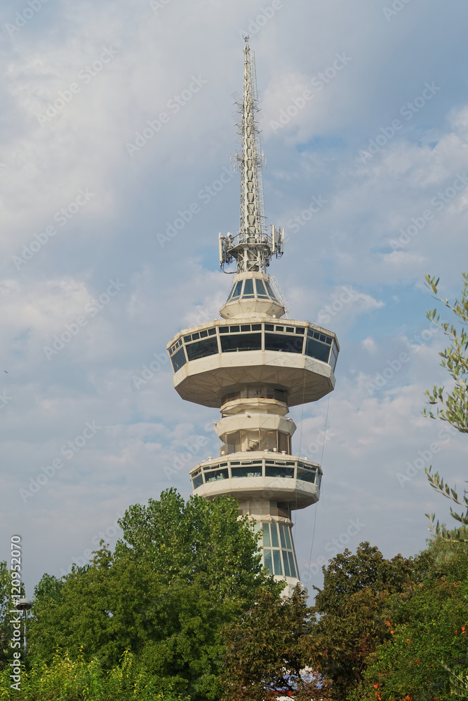 Thessaloniki, Greece - September 12 2016: OTE telecommunications tower south view. This 1966 tower stands 76 meters high from the ground. The top floor rotates, offering a city panorama. Thessaloniki, Greece - September 12 2016: OTE telecommunications tower south view. This 1966 tower stands 76 meters high from the ground. The top floor rotates, offering a city panorama.