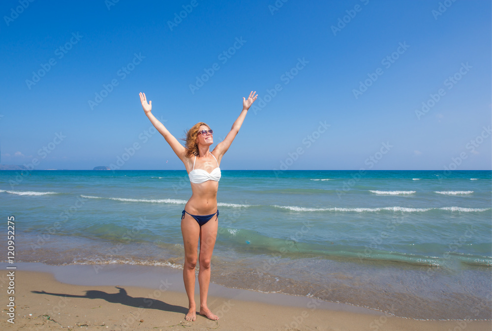 Cute brunette at the beach