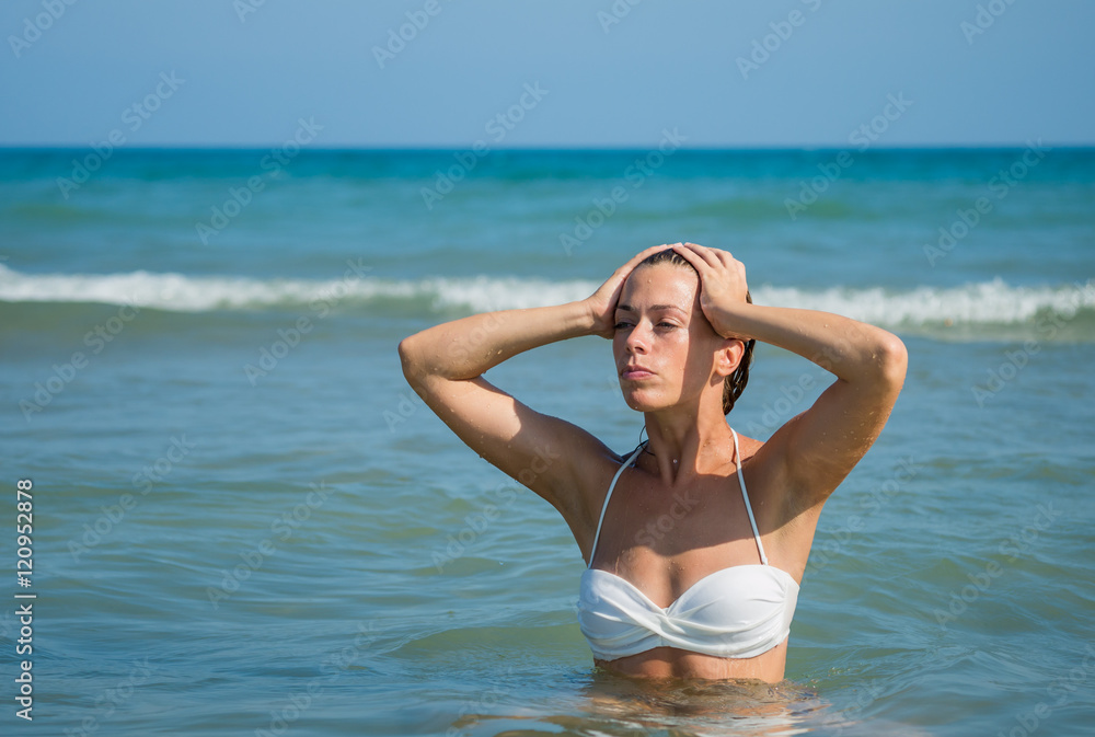 Fototapeta premium Cute brunette at the beach