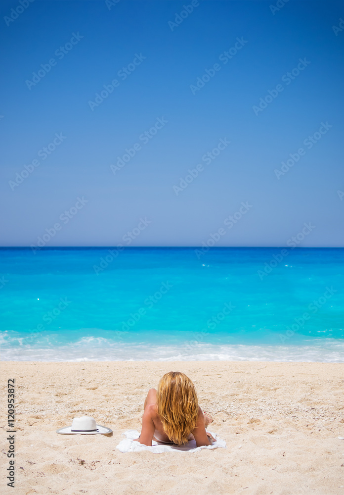 WOman on The famous Navagio Shipwreck beach in Zakynthos island WOman on The famous Navagio Shipwreck beach in Zakynthos island