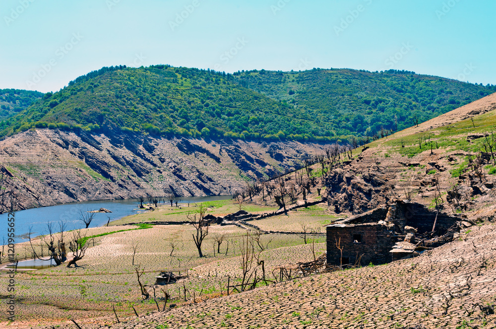 landscapes of  Ruins of the village of Chave (normally submerged), strains and terraces of vineyards in the Ribeira Sacra,  Galicia, Spain
