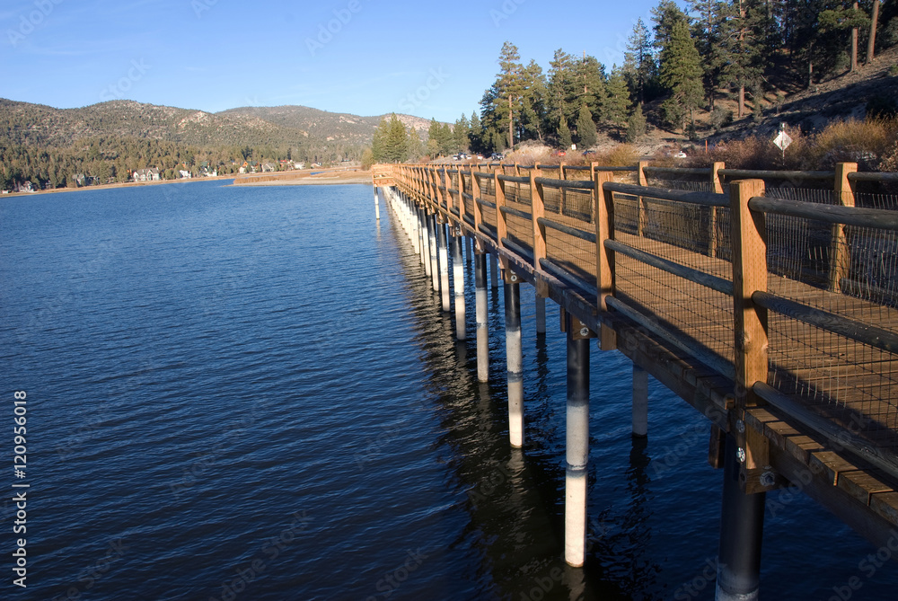 Naklejka premium Waterfront walkway at Sunset