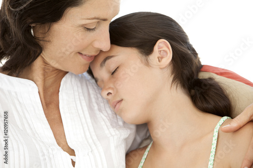 Moment of tenderness between mother and teenager daughter