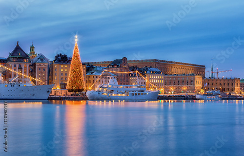 Stockholm city with illuminated christmas tree and Royal palace at christmas.