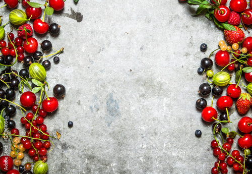 Fresh berries on a stone background.