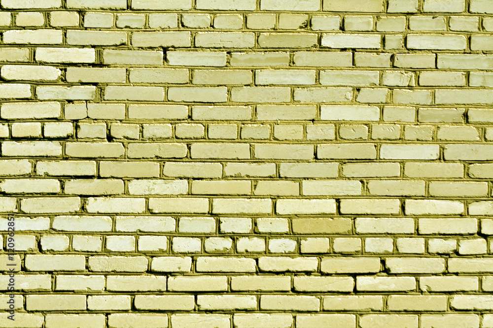 Obraz premium Weathered yellow brick wall texture.