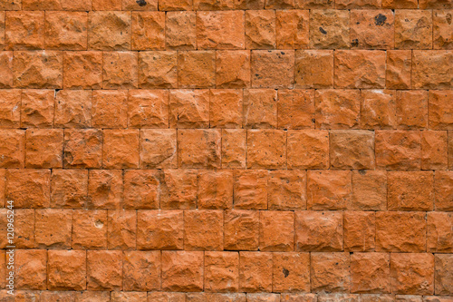 Wall of red stone  texture  background