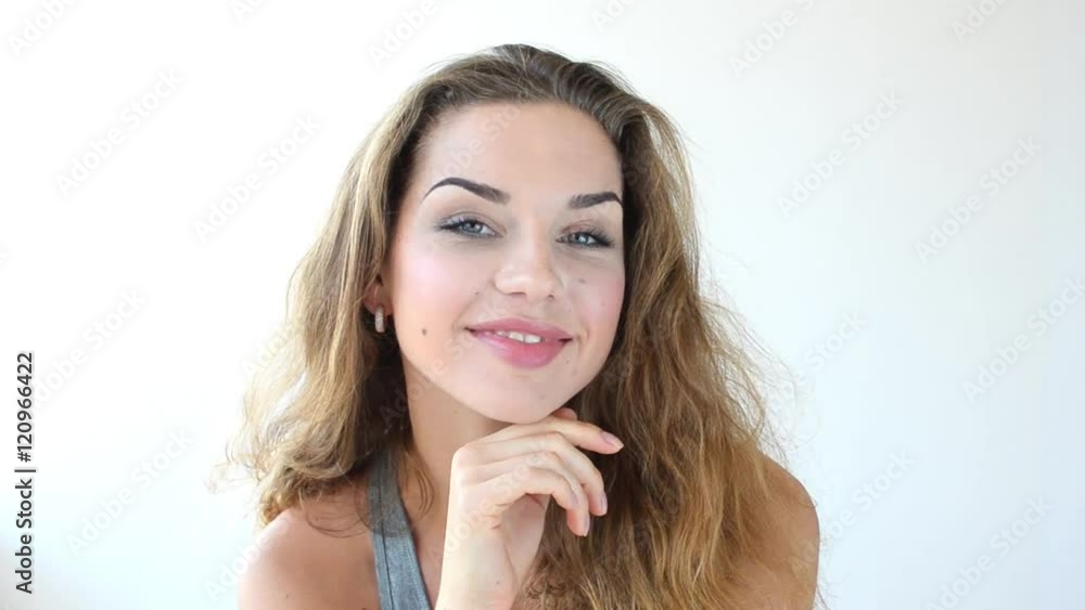 Beautiful woman videoportrait. She smile and posinf to the camera. Beautiful woman videoportrait. She smile and posinf to the camera.