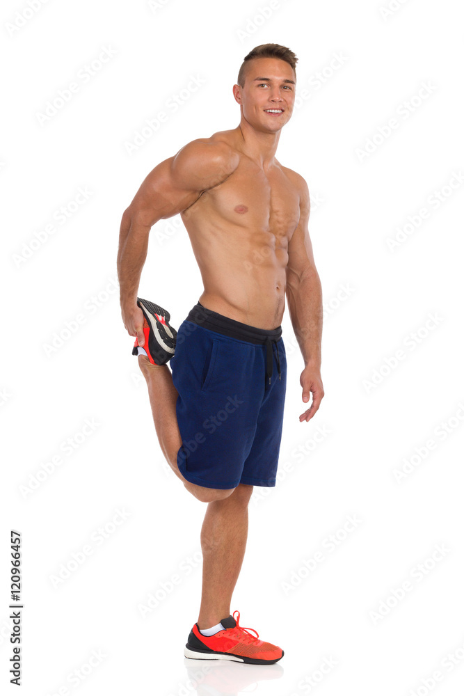 Fototapeta premium Standing Quadriceps Leg Stretches.