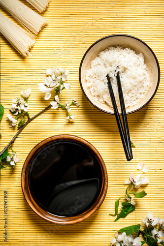Boiled rice with soy sauce and the cherry branches