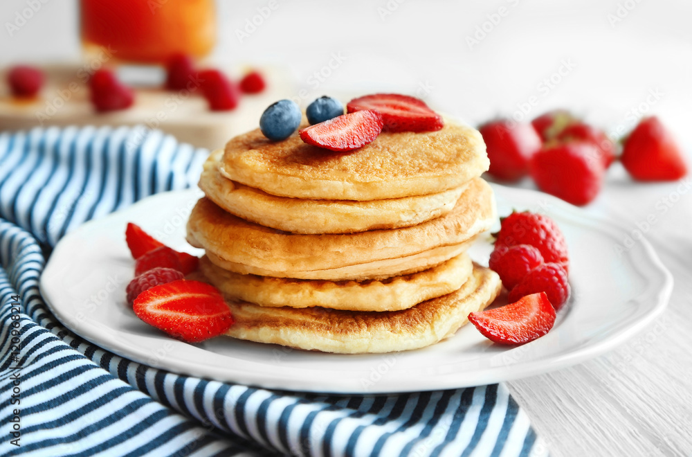 Tasty pancakes with fresh berries on plate Tasty pancakes with fresh berries on plate