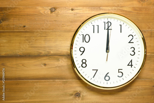 wall clock on the wooden wall