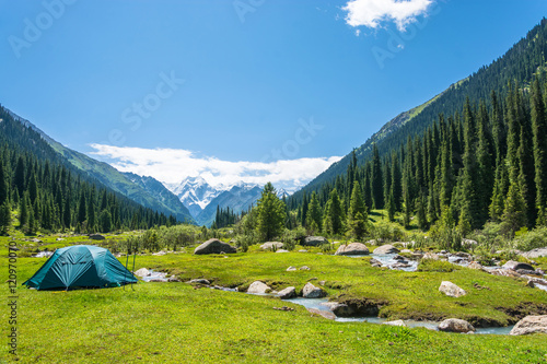 Blue tent on the banks of mountain rivers, Kyrgyzstan.