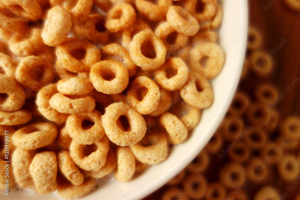 Cheerios - Bowl with cheerios whole grain cereals. Cheerios - Bowl with cheerios whole grain cereals.