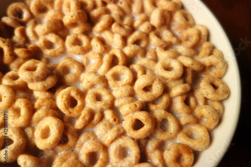 Cheerios - Bowl with cheerios whole grain cereals.  © nancy10