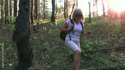 She travels through the woods. slow motion