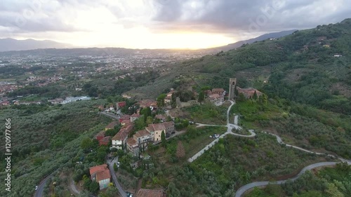 gorgeous tuscany flyover with the sunset light made with the drone / le colline toscane e i suoi paesini ripresi con il drone photo