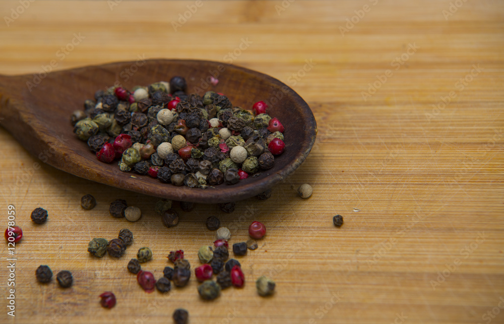 close up on pepper mix on wood close up on pepper mix on wood