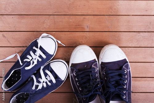 Old canvas shoes on a wooden floor