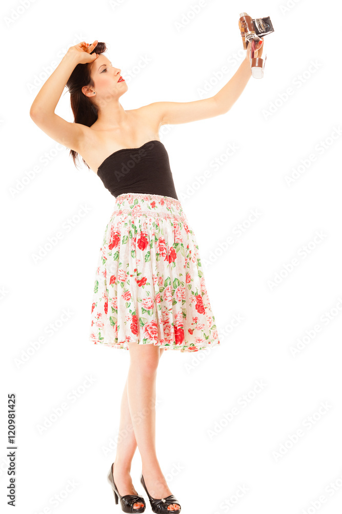 Fototapeta premium Girl taking self portrait from vintage camera