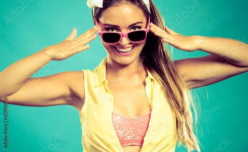 Attractive pin up lady with sunglasses.