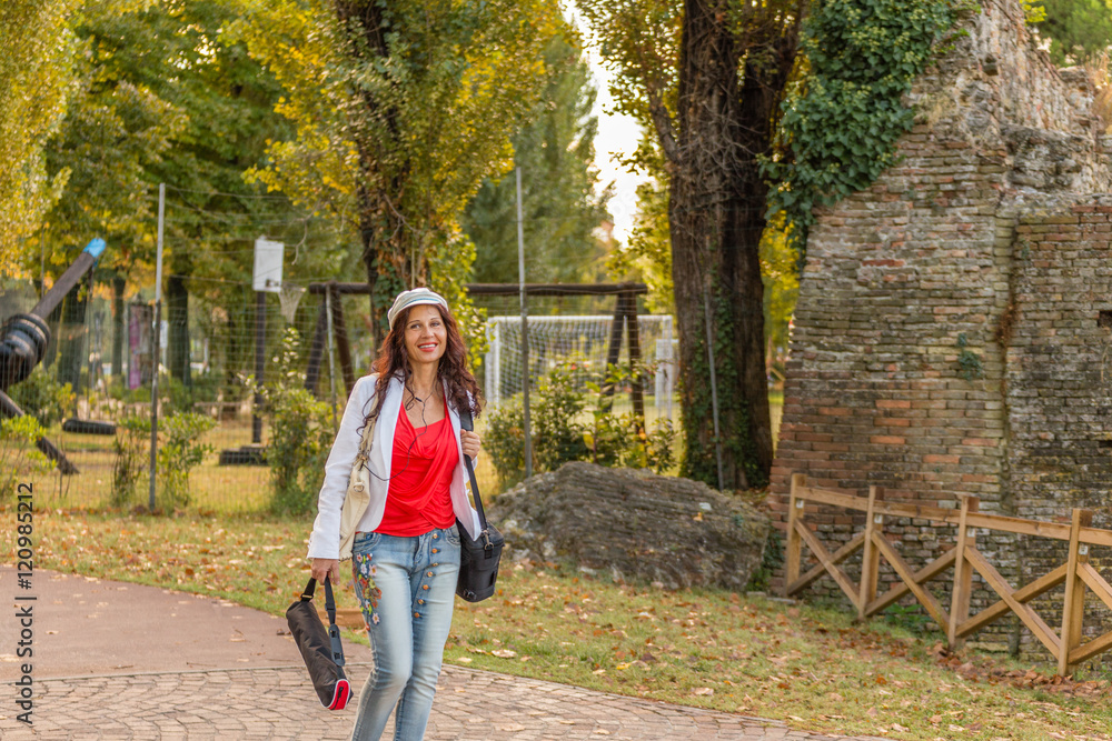 tourist walking next to Roman ruins tourist walking next to Roman ruins