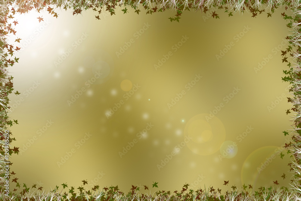 Golden brown background with a border of leaves, grass and flare Golden brown background with a border of leaves, grass and flare