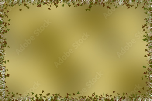 Golden brown background with a border of leaves and grass