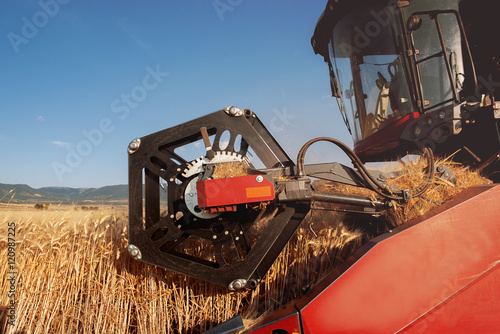 detail of a combine harvester in action