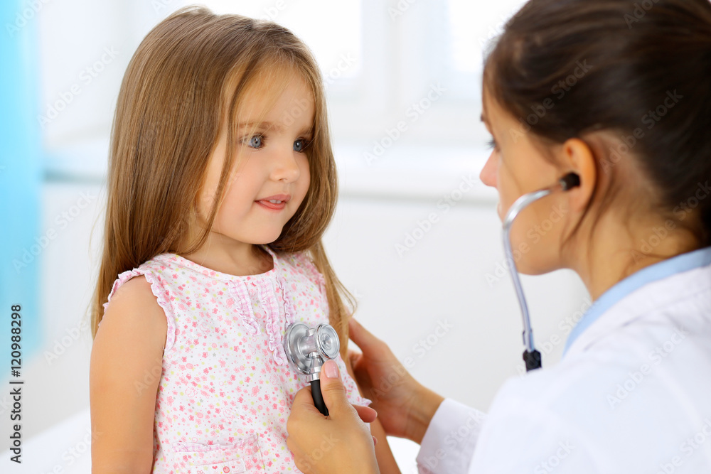 Doctor examining a little girl by stethoscope