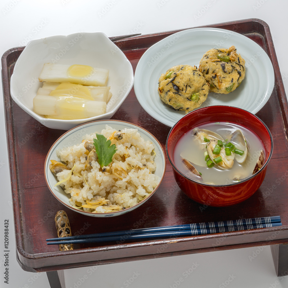 Table meal of fried rice with meat ball, clam soup and egg in Ja Table meal of fried rice with meat ball, clam soup and egg in Ja