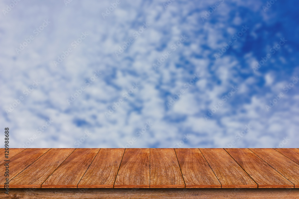 Wood table top on blurred blue sky background , can be used for Wood table top on blurred blue sky background , can be used for
