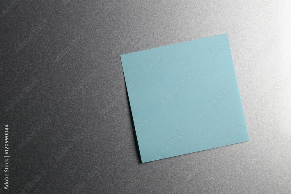 Empty blue paper sheet on refrigerator door. Empty blue paper sheet on refrigerator door.