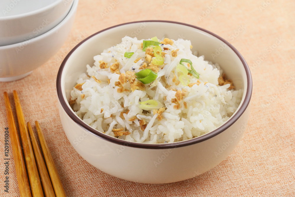 Calcium kiss fish meal with rice in white bowl Calcium kiss fish meal with rice in white bowl