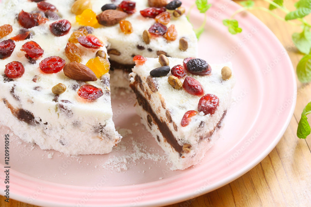 Red bean sponge cake with almond and berry on white plate