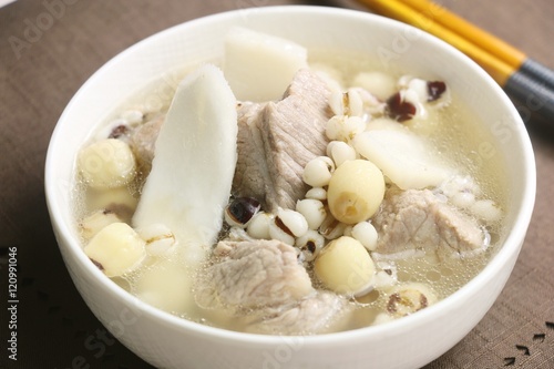 Sishen soup with lotus bean and pork ribs in white bowl