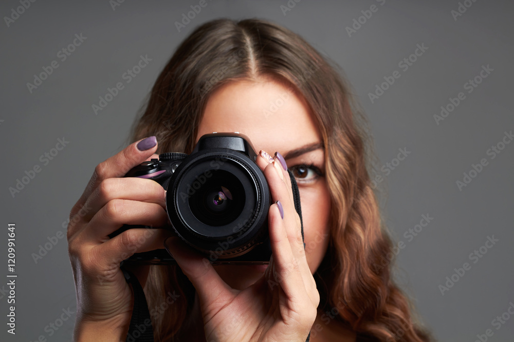 beautiful girl with camera.Pretty woman is a professional photographer beautiful girl with camera.Pretty woman is a professional photographer