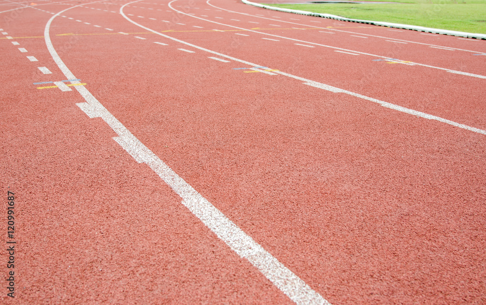 Red running track in stadium. Red running track in stadium.