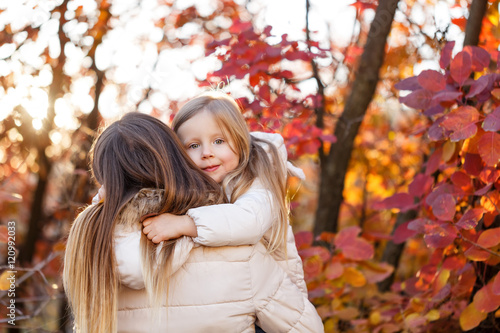 Cute family hug. Autumn