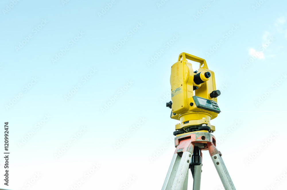 Closeup theodolite outdoors at construction road  Selective focus.