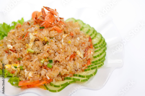 Fried rice with sliced cucumber and dried small shrimps on white