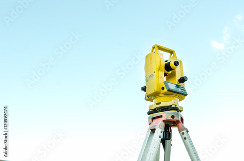 Фотография Closeup theodolite outdoors at construction road  Selective focus