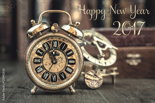 Vintage alarm clock showing five to twelve, text