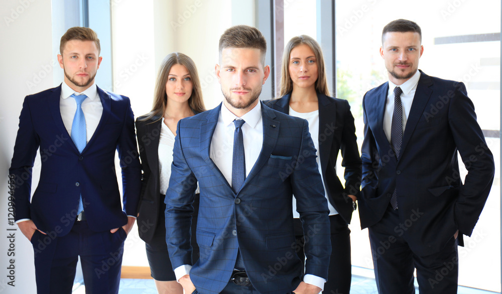 Group portrait of a professional business team looking confidently at camera Group portrait of a professional business team looking confidently at camera
