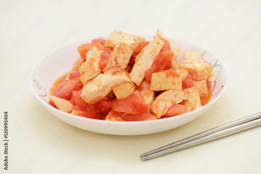 Tomato Tofu positive mix fry on white background Tomato Tofu positive mix fry on white background