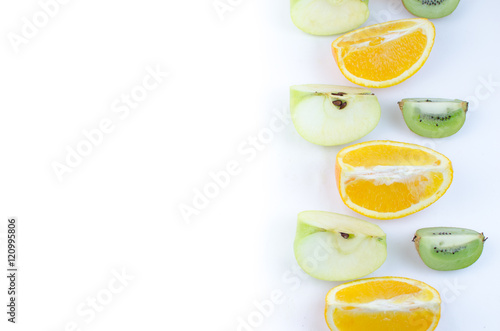 Fruits orange  apple  kiwi  sliced on a white background.