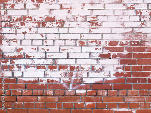 red brick wall with damage paint