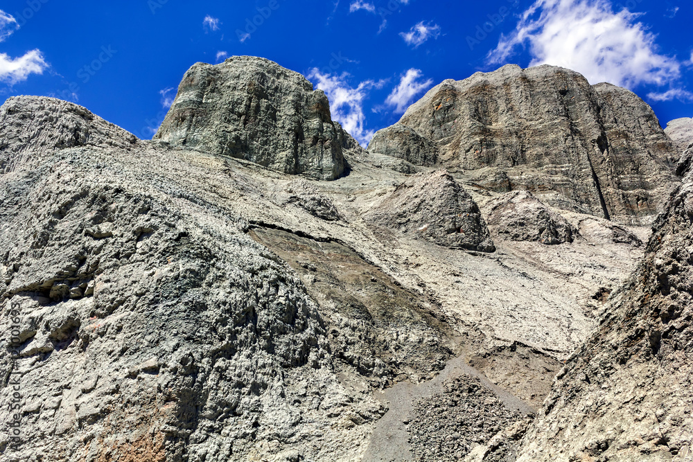 colorful rocks on the background of blue sky with clouds colorful rocks on the background of blue sky with clouds